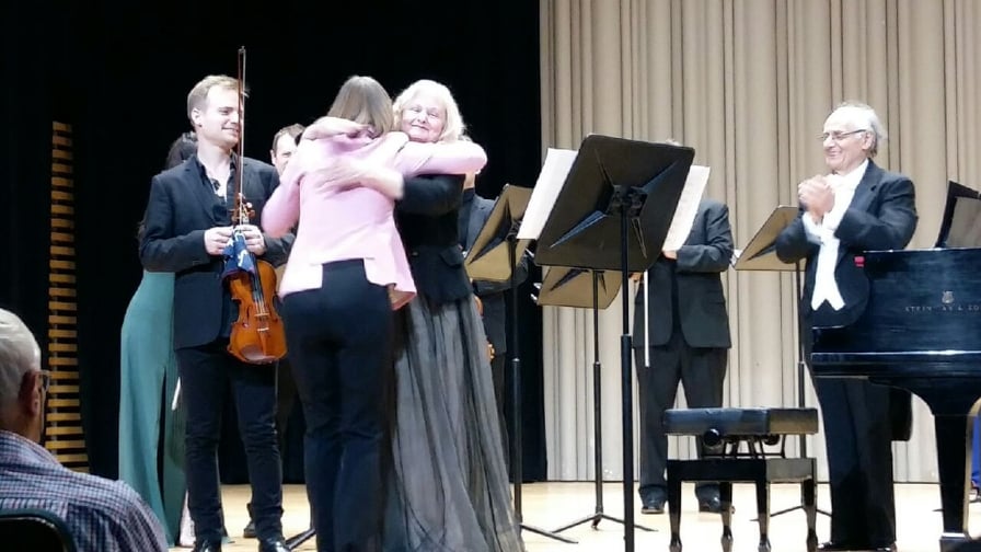 Christina with composer Larysa Kuzmenko hugging her and violinist Marc Djokic after the world premiere of a concerto she wrote for Christina and Marc